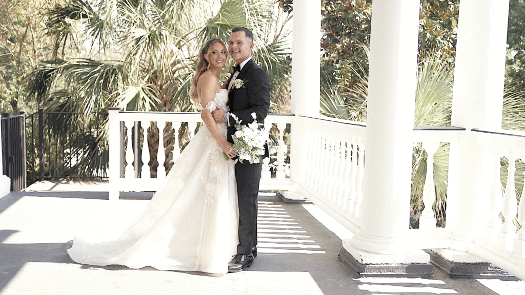 Couple poses on the veranda at Lowndes Grove.